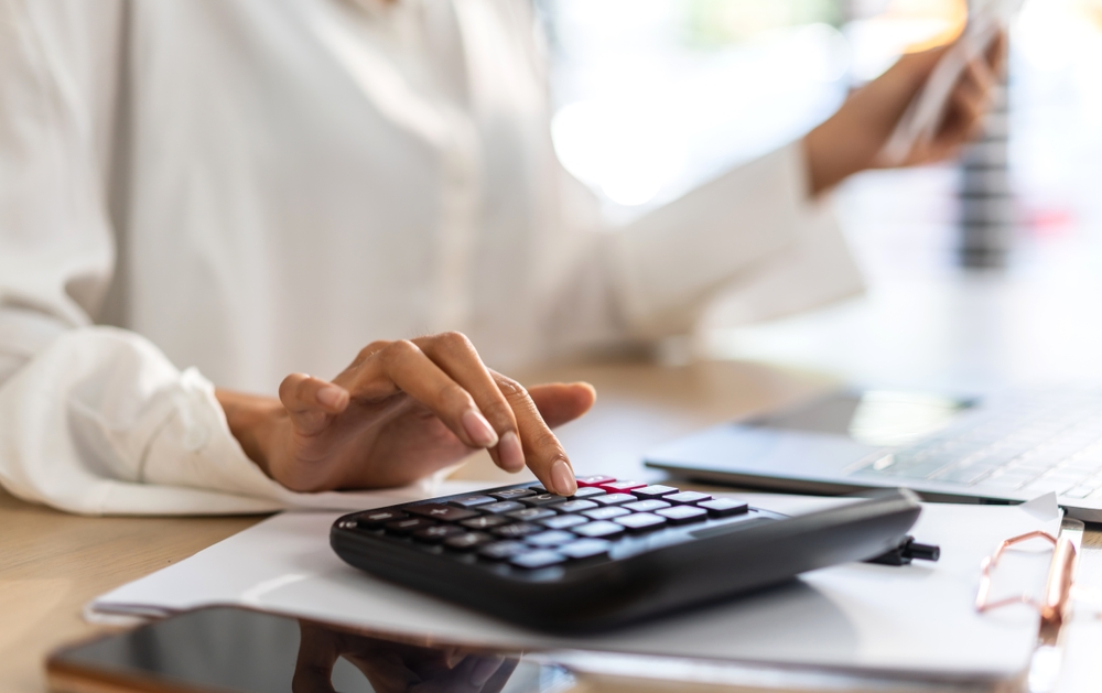 Woman doing an electricity bill audit for a business